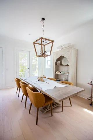 a view of an empty room and wooden floor