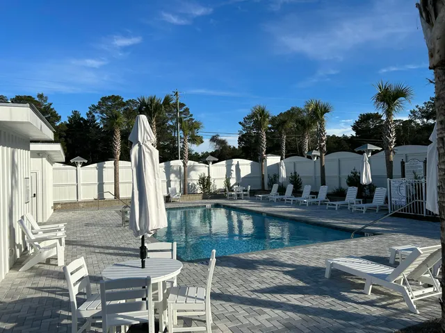 a view of a swimming pool with a patio