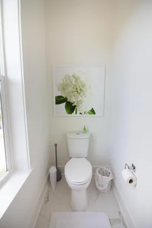 a en suite bathroom with a double vanity sink a mirror and shower