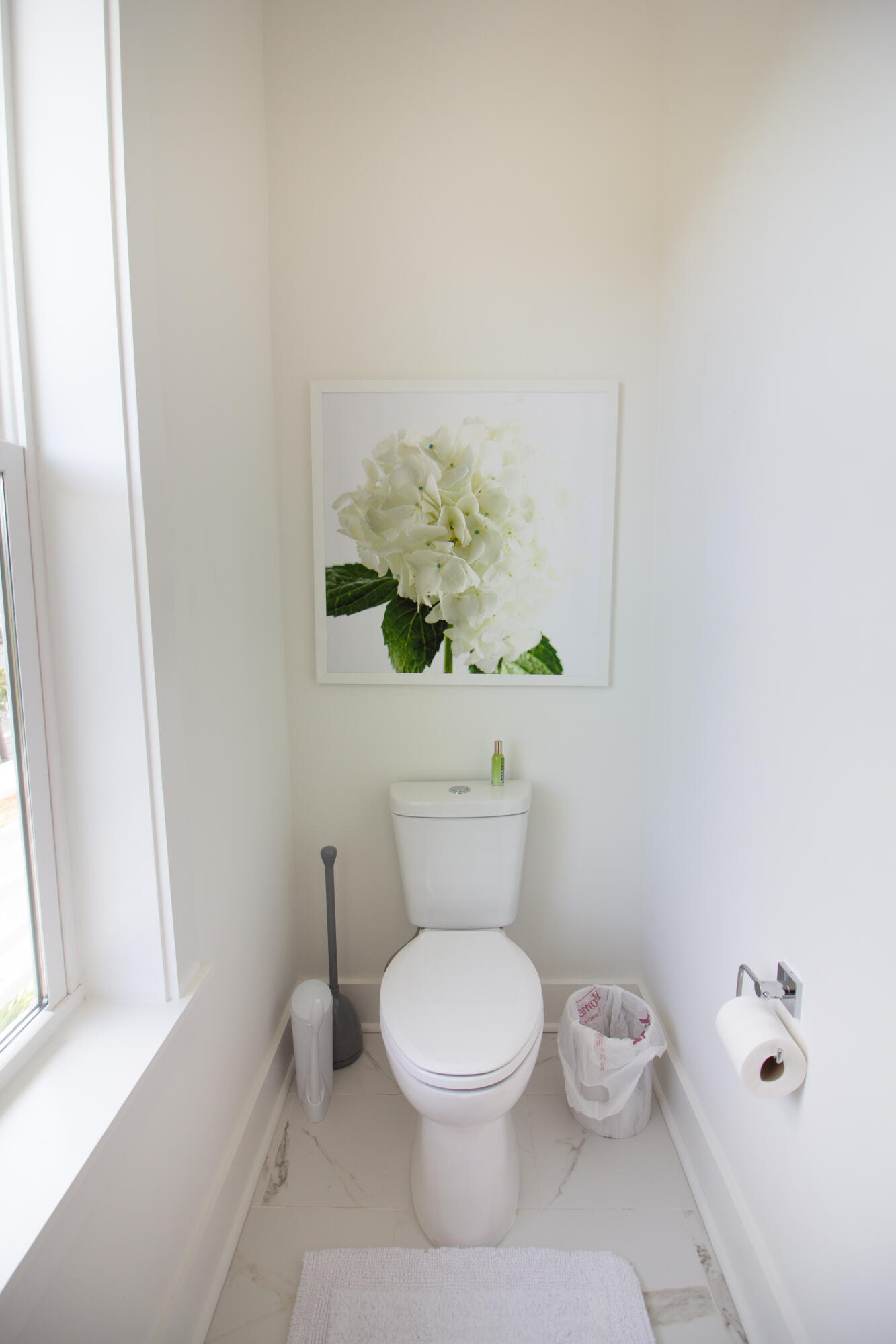 141 Valdare Ln Inlet Beach Inlet Beach, FL 32461 - Photo 32 of 55 a white toilet sitting next to a bathroom sink