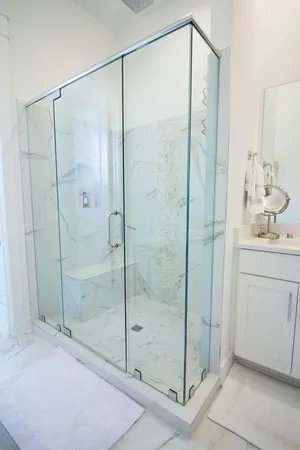 a en suite bathroom with a sink and a mirror