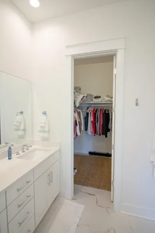 a view of a bedroom with a bed and a window