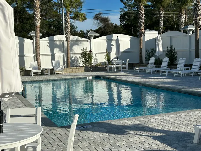 a view of a lake with a house and outdoor space