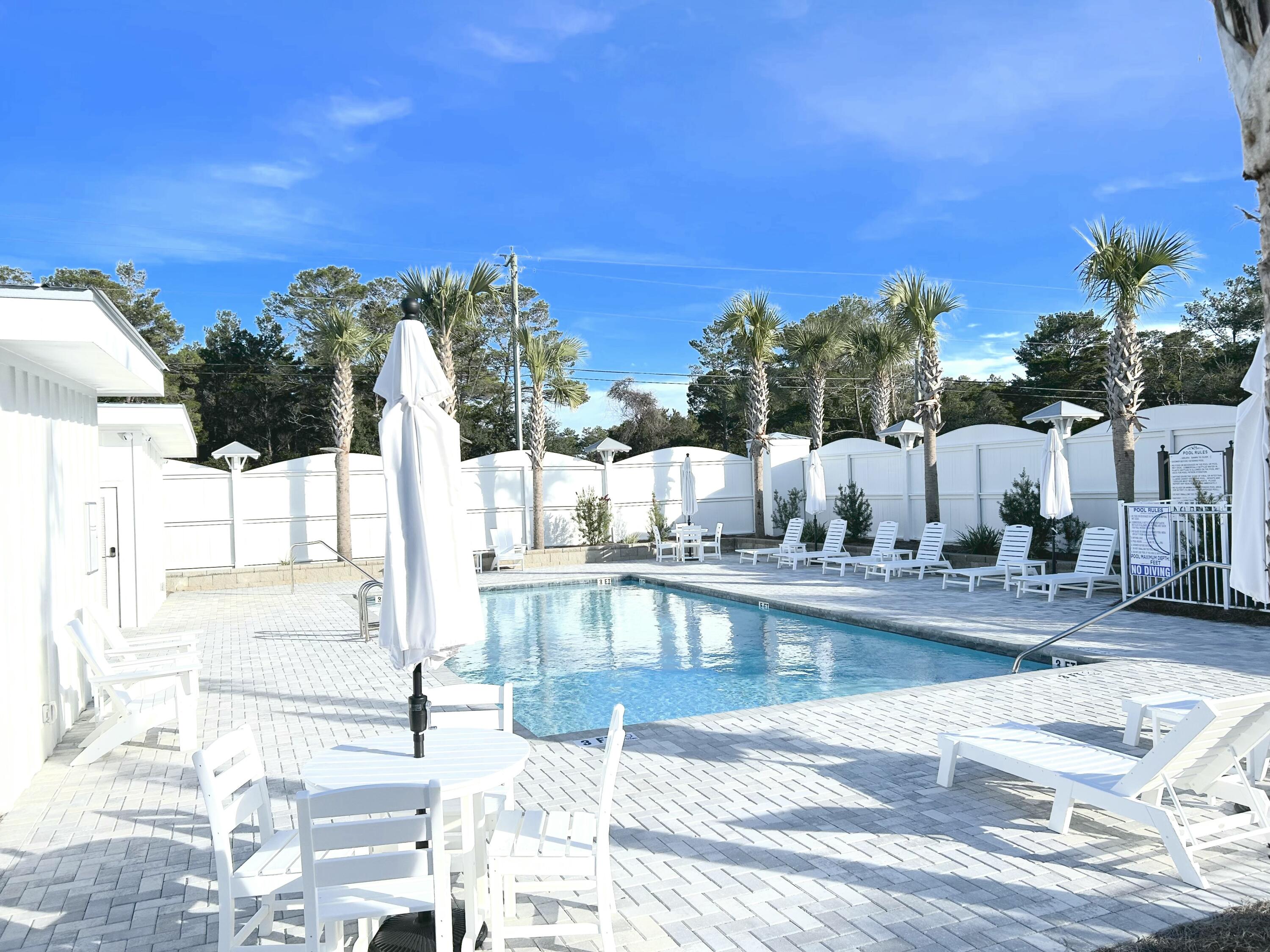 141 Valdare Ln Inlet Beach Inlet Beach, FL 32461 - Photo 10 of 55 a view of a swimming pool with an outdoor seating