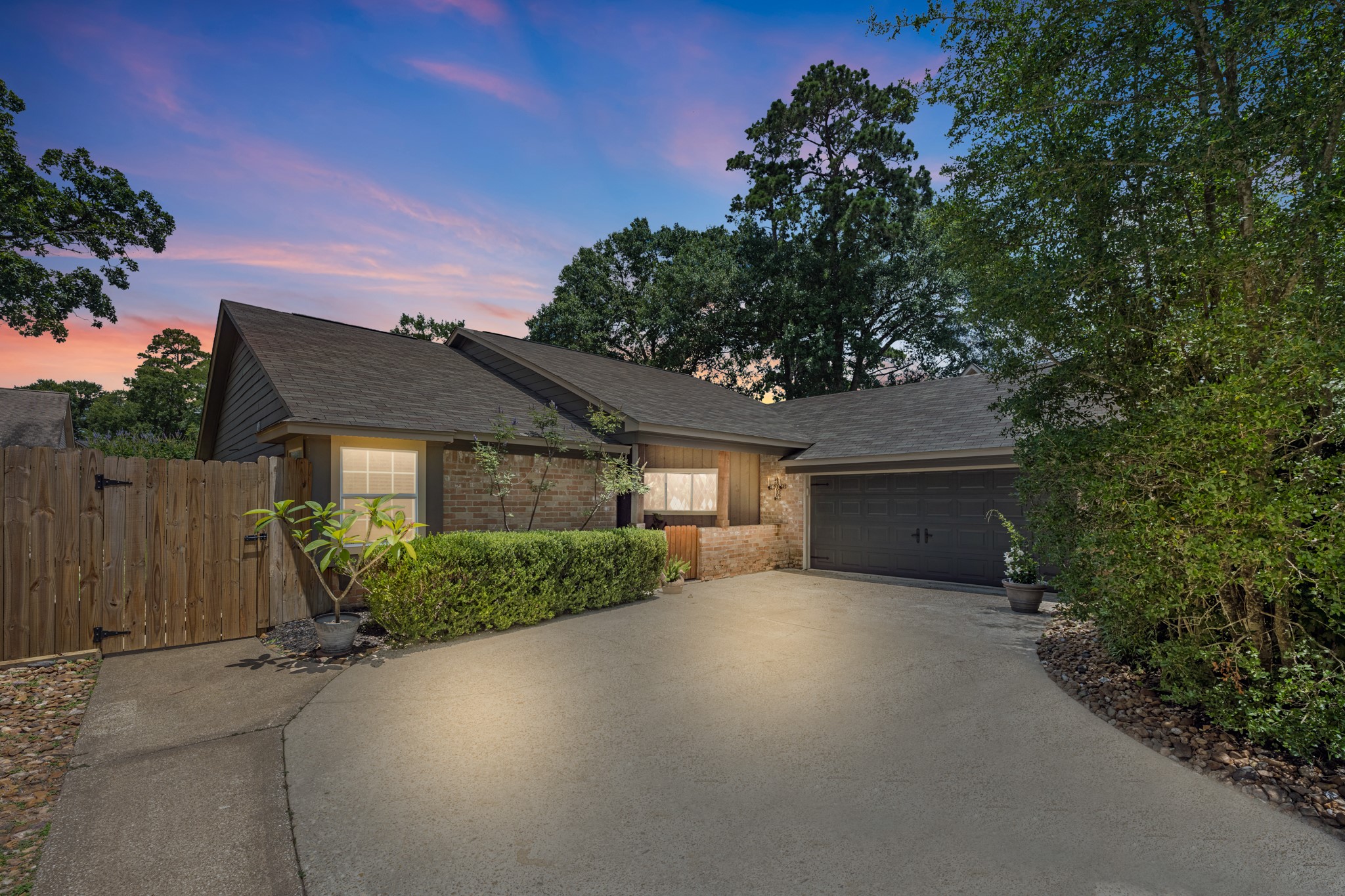 622 South Rivershire Drive Conroe, TX 77304 - Photo 1 of 44 a front view of a house with a yard and garage