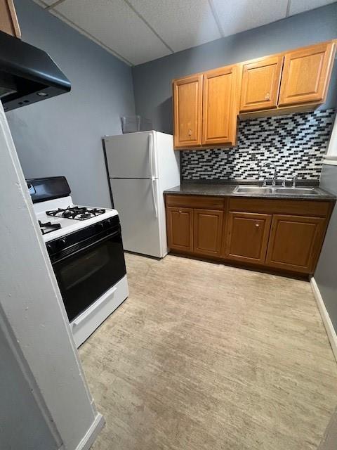 568 Merchant Street Ambridge, PA 15003 - Photo 15 of 20 a kitchen with a stove and a refrigerator