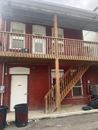 a front view of a house with parking space