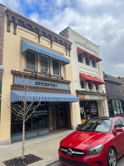 568 Merchant Street Ambridge, PA 15003 - Photo 18 of 20 a front view of a house with parking space