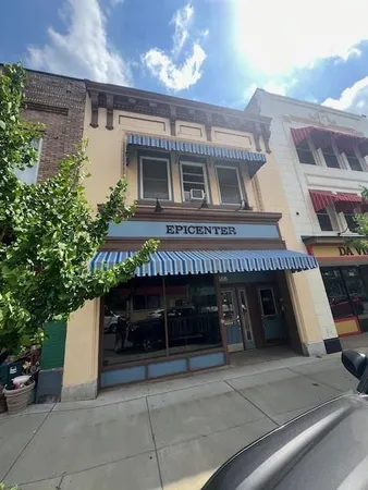 a front view of a building with garage
