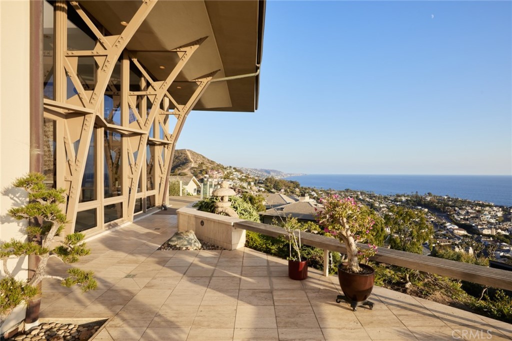 1513 Emerald Bay Laguna Beach, CA 92651 - Photo 12 of 44 a view of a patio with table and chairs and potted plants