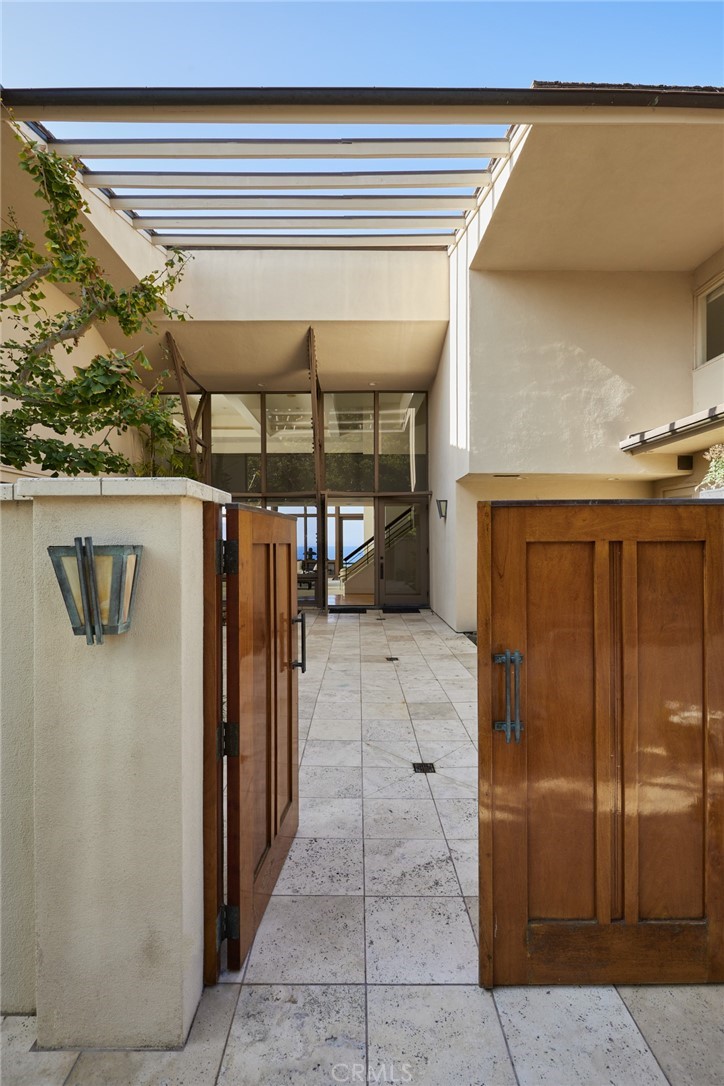 1513 Emerald Bay Laguna Beach, CA 92651 - Photo 16 of 44 a view of a porch with furniture and a garage