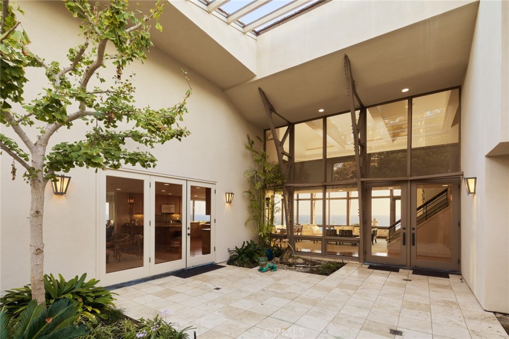 1513 Emerald Bay Laguna Beach, CA 92651 - Photo 18 of 44 a view of a patio with table and chairs and potted plants