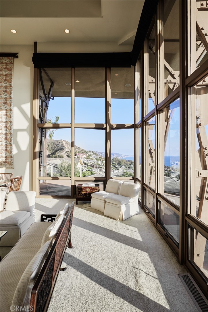 1513 Emerald Bay Laguna Beach, CA 92651 - Photo 20 of 44 a large room with a large window and furniture