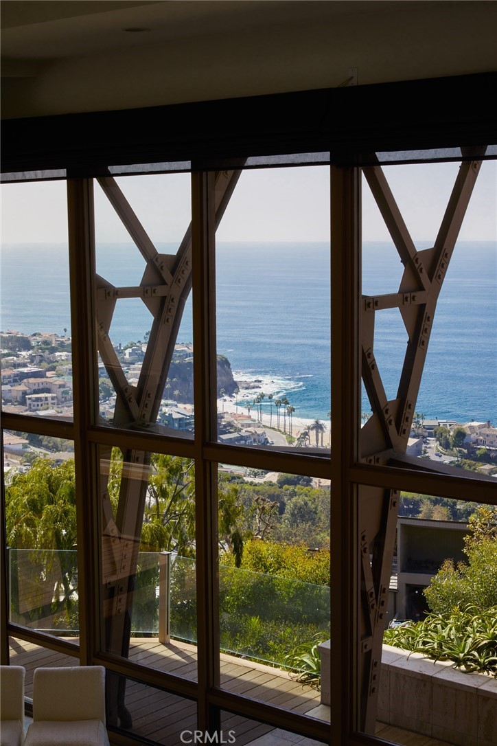 1513 Emerald Bay Laguna Beach, CA 92651 - Photo 26 of 44 a view of a glass door with a tree