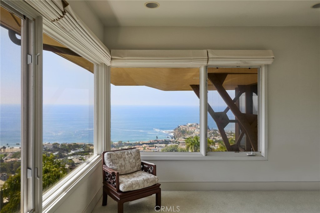 1513 Emerald Bay Laguna Beach, CA 92651 - Photo 30 of 44 a view of a porch with furniture and front door