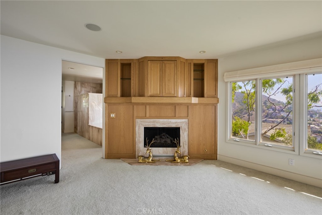 1513 Emerald Bay Laguna Beach, CA 92651 - Photo 31 of 44 a living room with furniture and a fireplace
