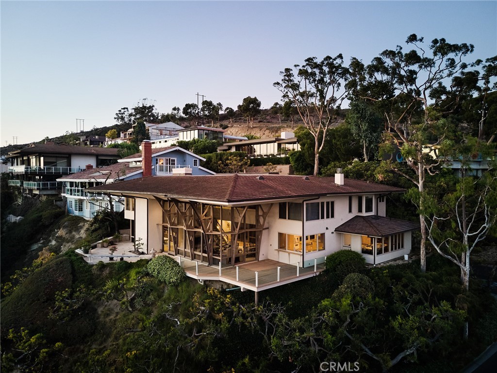 1513 Emerald Bay Laguna Beach, CA 92651 - Photo 7 of 44 a front view of a house with a garden