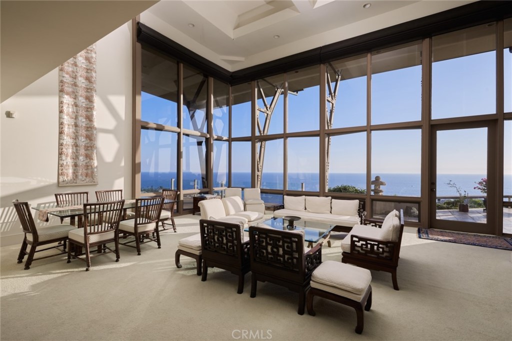 1513 Emerald Bay Laguna Beach, CA 92651 - Photo 8 of 44 a living room with furniture and floor to ceiling windows