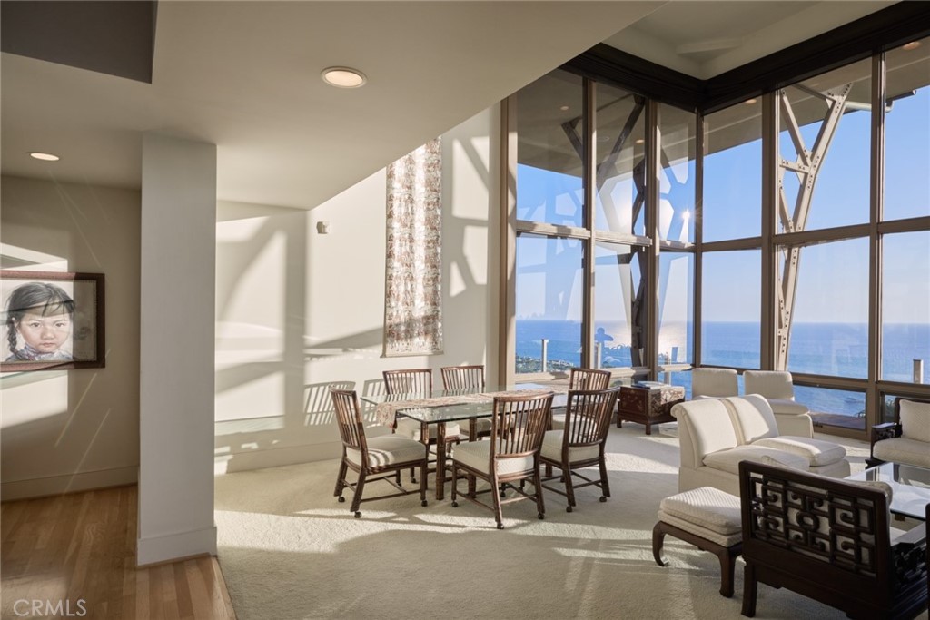 1513 Emerald Bay Laguna Beach, CA 92651 - Photo 9 of 44 a living room with furniture and floor to ceiling windows