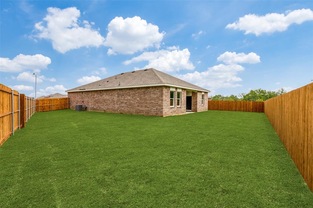 41 Glen Crossings Road Fort Worth, TX 76134 - Photo 12 of 12 a view of a house with a backyard