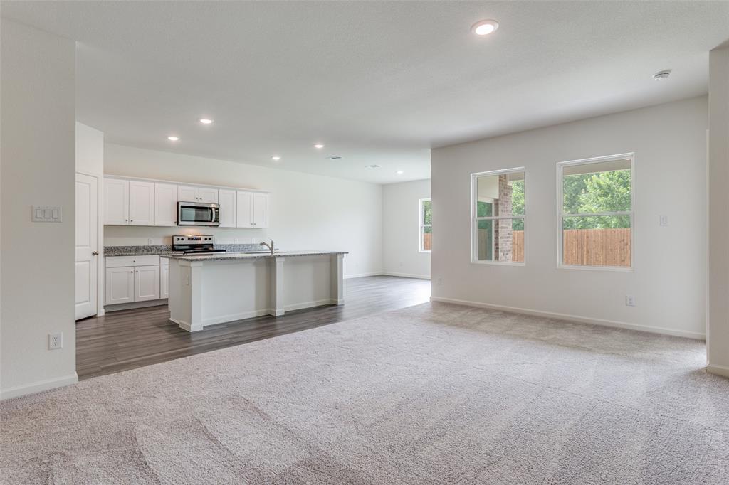 41 Glen Crossings Road Fort Worth, TX 76134 - Photo 4 of 12 a view of kitchen with refrigerator sink and stove