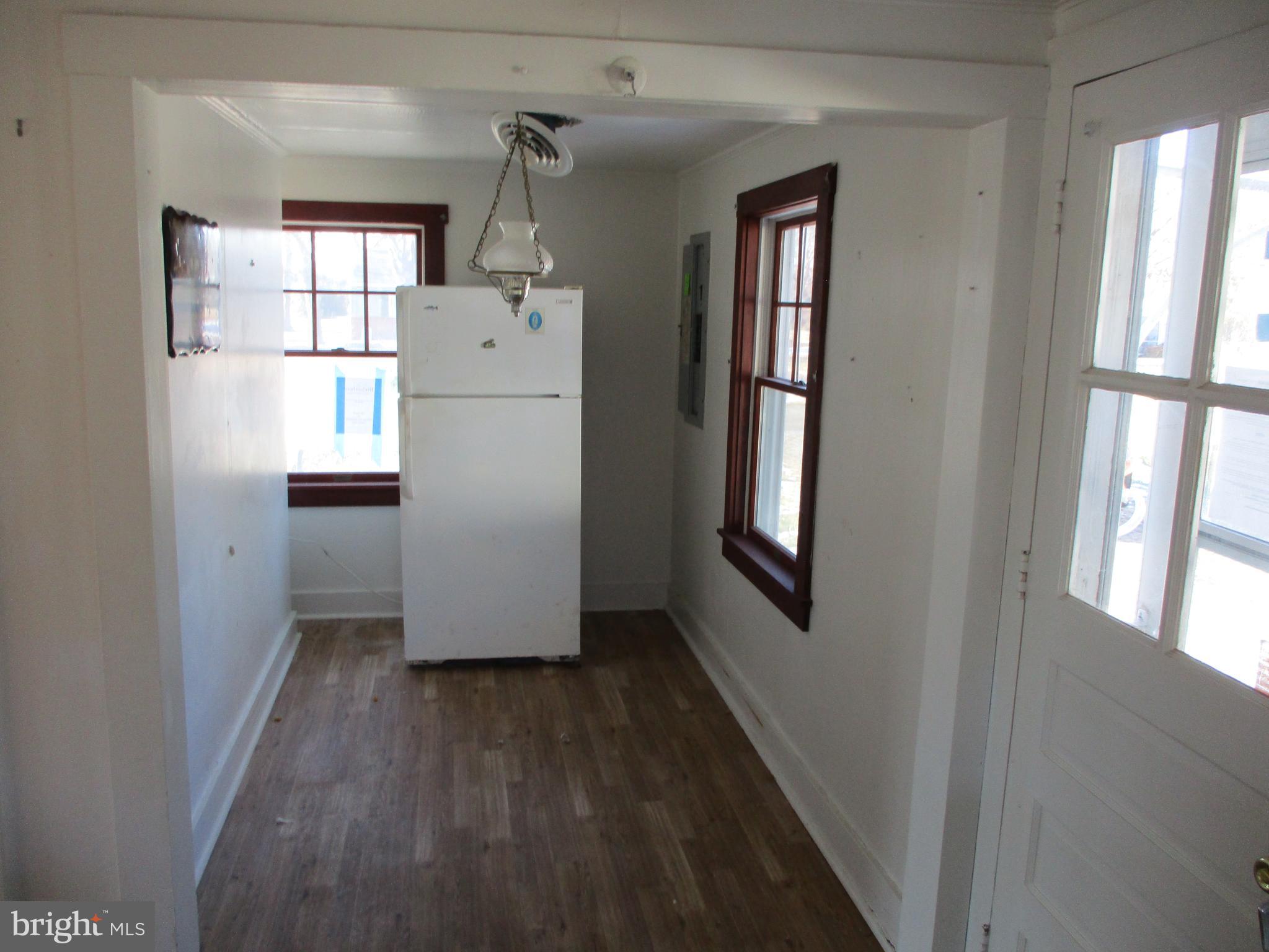 6369 Neavitt Manor Road Neavitt, MD 21652 - Photo 5 of 10 a view of a hallway with wooden floor and entryway