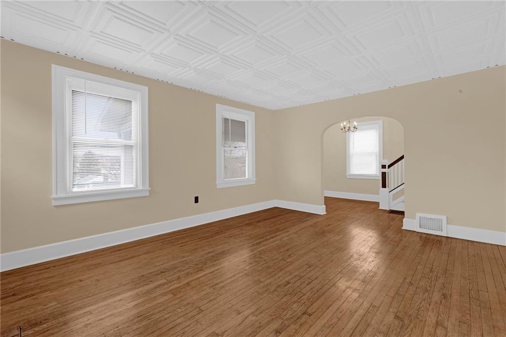 545 Virginia Avenue Rochester, PA 15074 - Photo 6 of 21 a view of empty room with wooden floor and fan