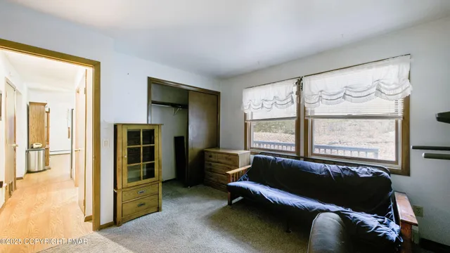 a living room with furniture and a window