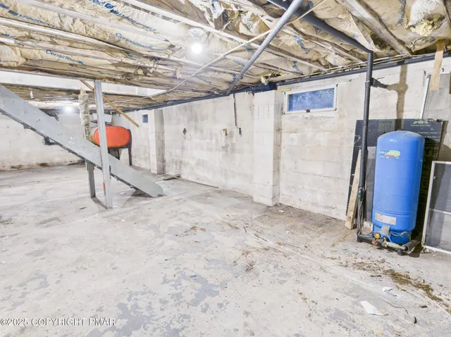 a view of living room with furniture and wooden floor