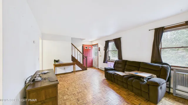 a living room with furniture and a window