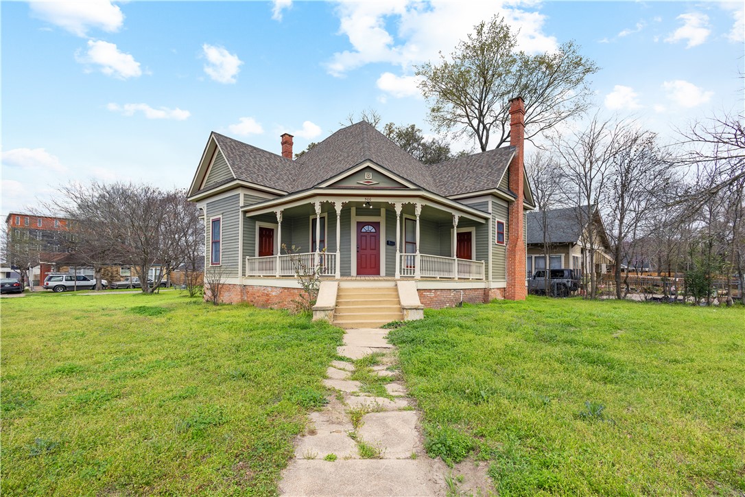 front view of a house with a yard