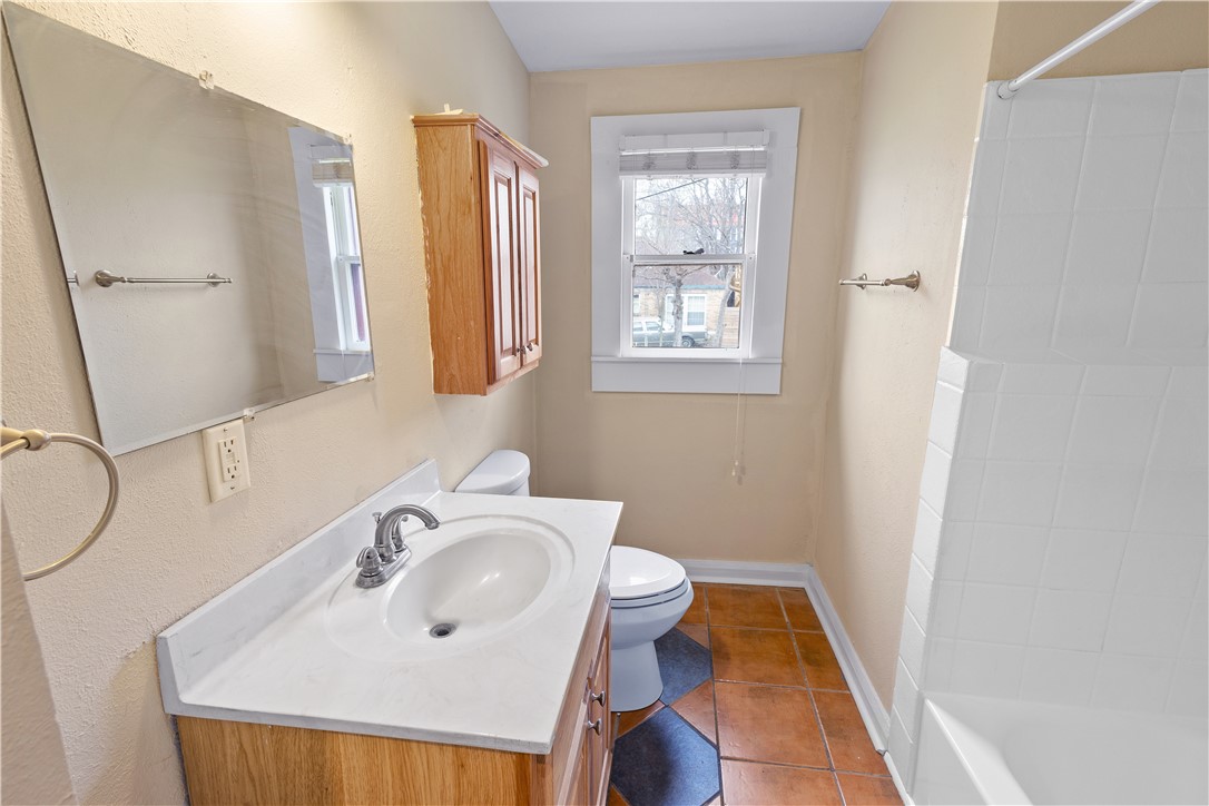 500 North Washington Avenue Bryan, TX 77803 - Photo 11 of 15 a bathroom with a sink and a mirror