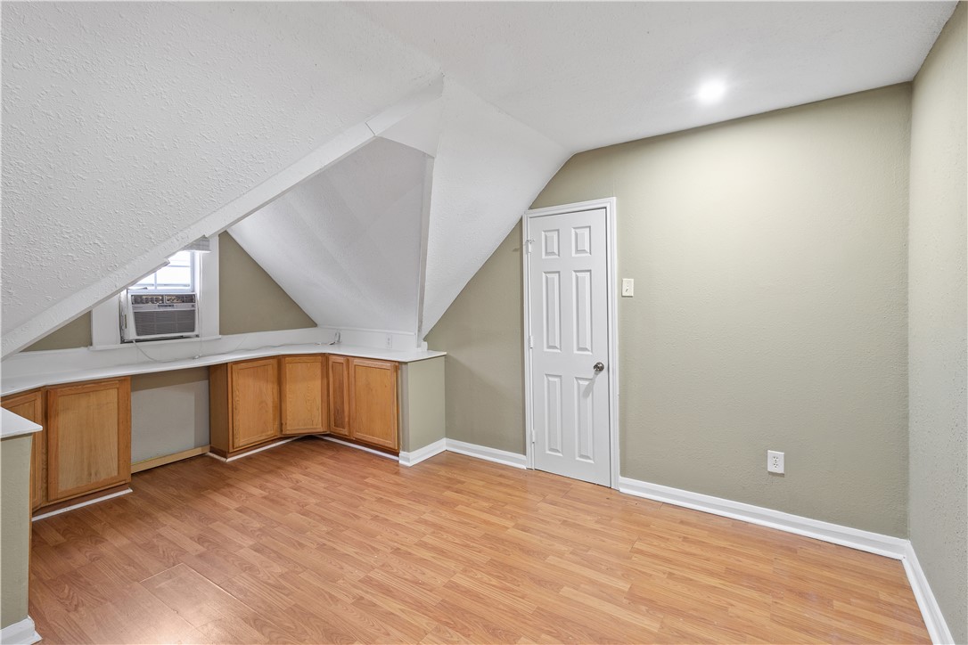500 North Washington Avenue Bryan, TX 77803 - Photo 13 of 15 a view of an empty room with wooden floor