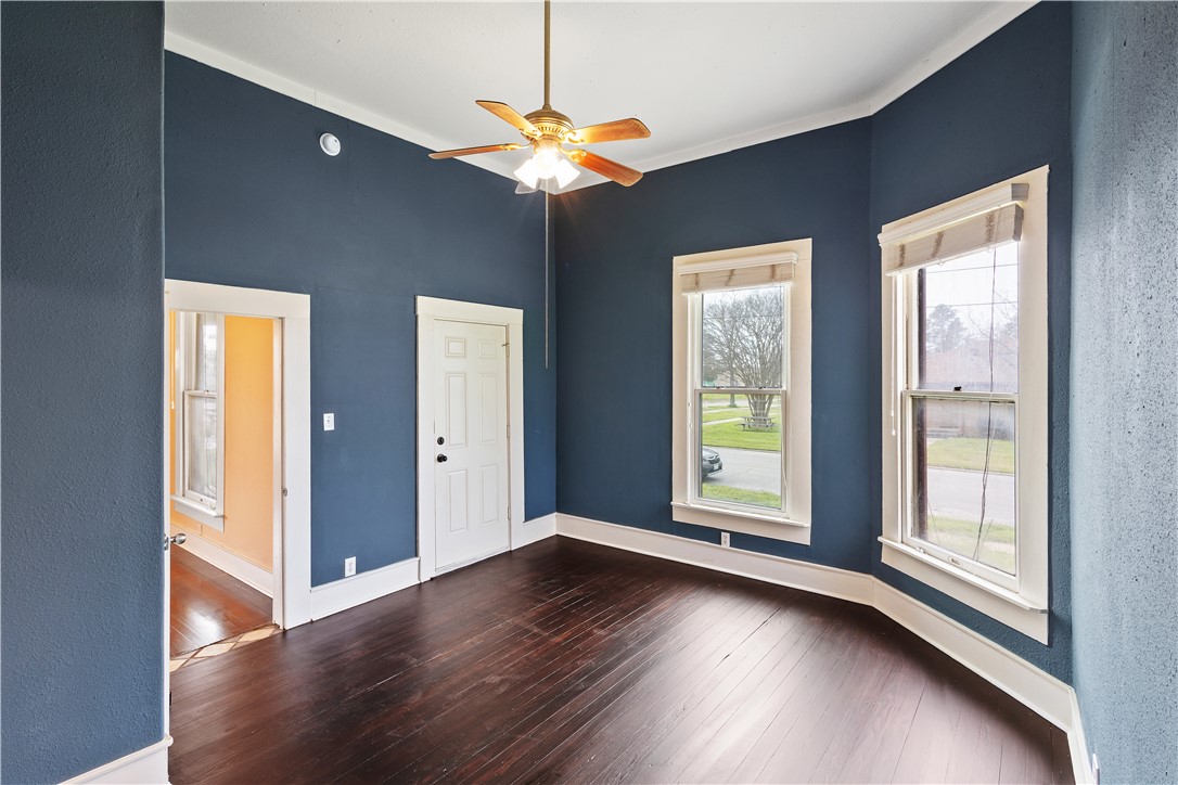 500 North Washington Avenue Bryan, TX 77803 - Photo 4 of 15 a view of an empty room with wooden floor and a window