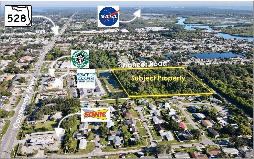 0 North Pioneer Road Merritt Island, FL 32953 - Photo 3 of 3 an aerial view of residential houses with outdoor space