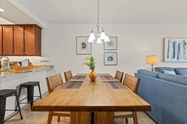 a living room with furniture ceiling fan and a rug