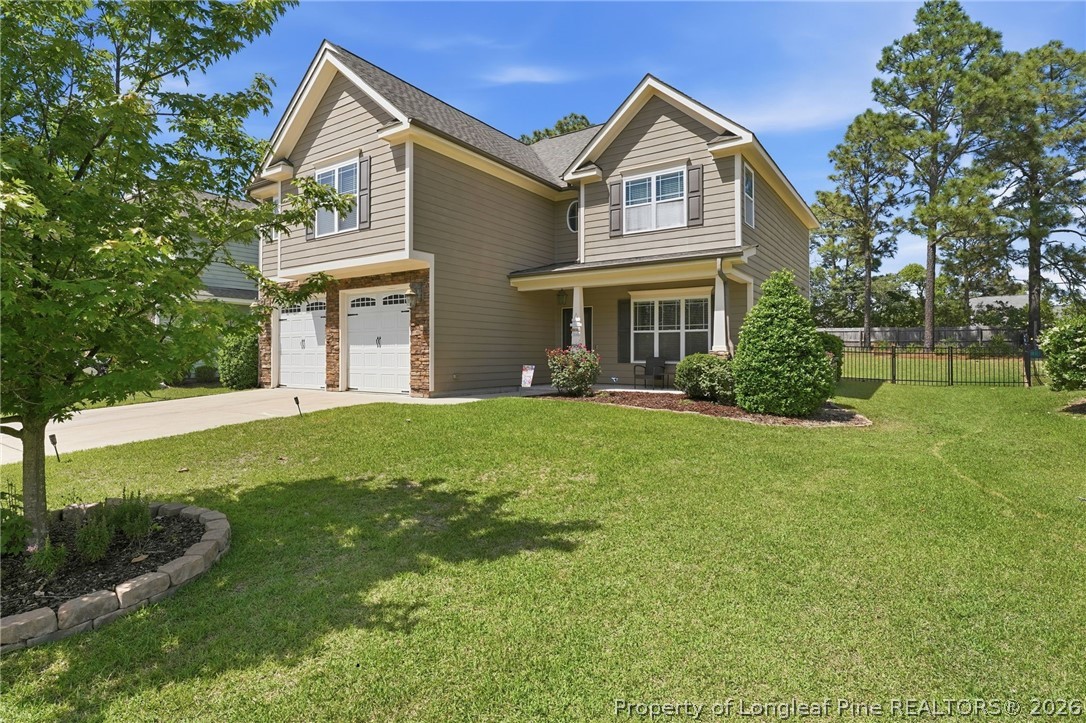 886 Micahs Way North Spring Lake, NC 28390 - Photo 43 of 50 a front view of house with yard and green space