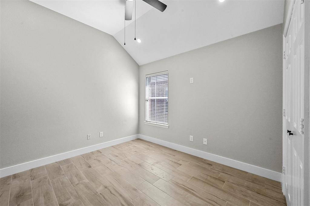 2667 Lake Ridge Drive Little Elm, TX 75068 - Photo 14 of 17 wooden floor in an empty room with a window