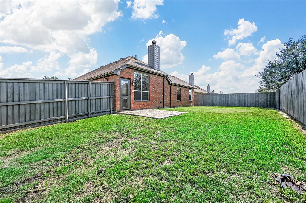 2667 Lake Ridge Drive Little Elm, TX 75068 - Photo 15 of 17 a front view of a house with garden