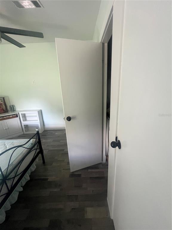 5855 Jack Brack Road St. Cloud, FL 34771 - Photo 66 of 86 a view of bedroom with furniture and wooden floor