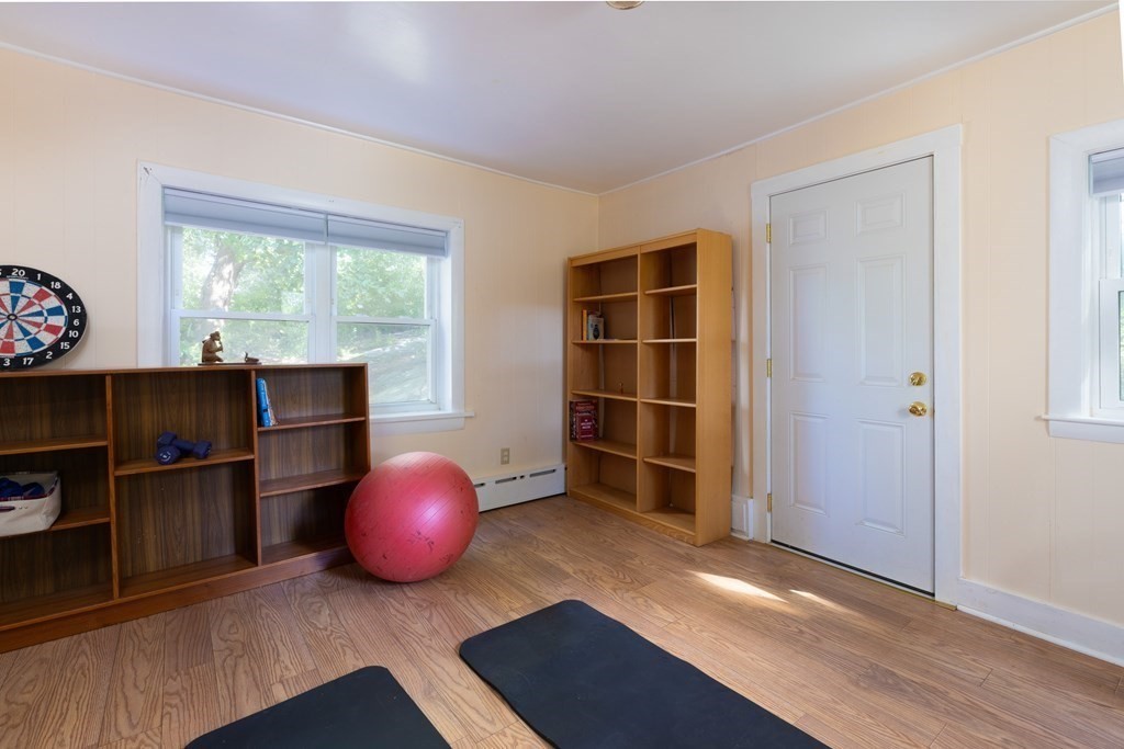 9 Belfry Terrace Lexington, MA 02421 - Photo 11 of 23 a room with wooden floor and windows