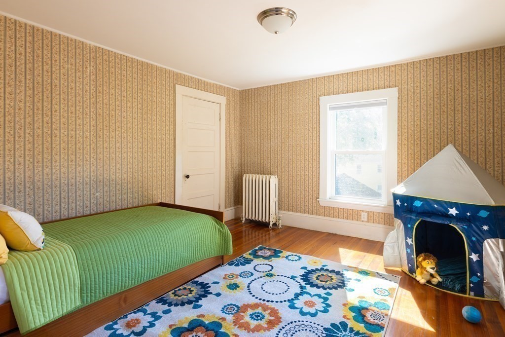 9 Belfry Terrace Lexington, MA 02421 - Photo 14 of 23 a living room with a fireplace furniture and a window