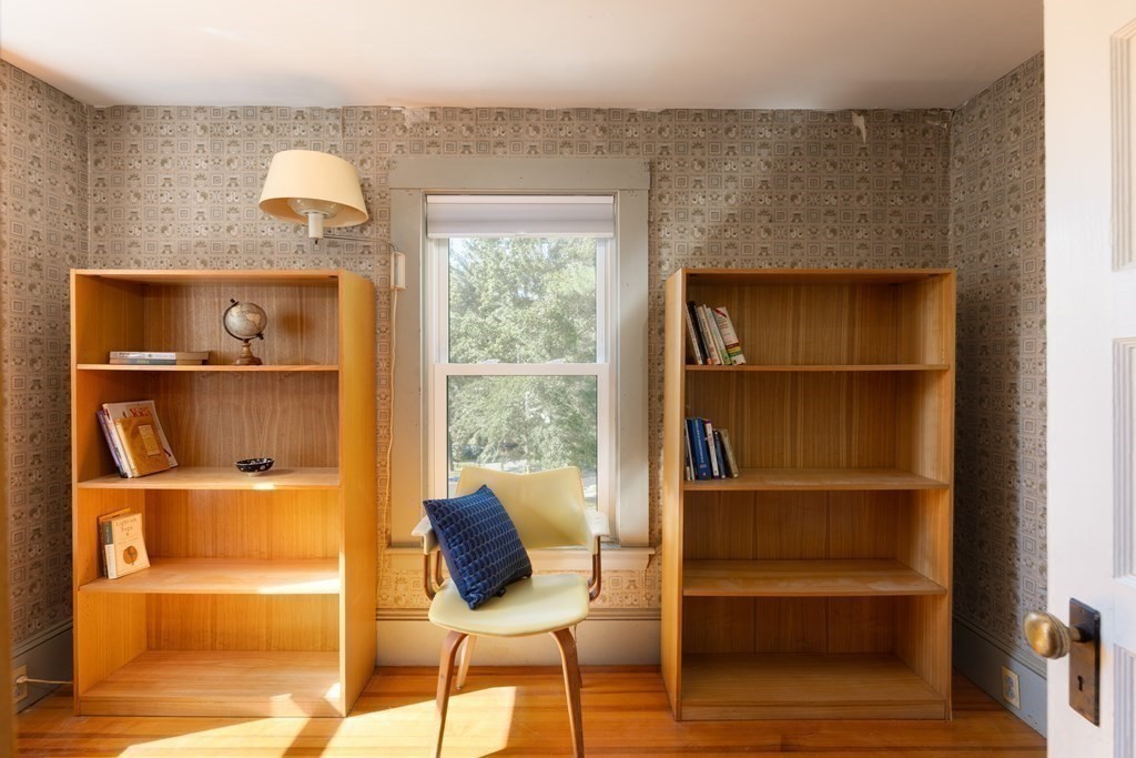 9 Belfry Terrace Lexington, MA 02421 - Photo 18 of 23 a living room with a wooden floor and a window