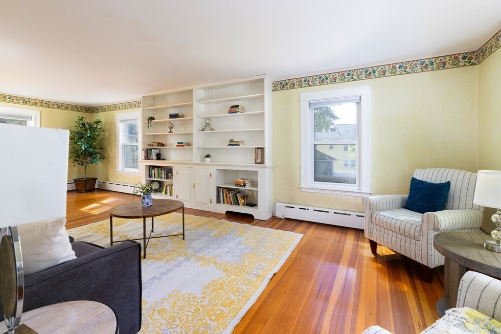 9 Belfry Terrace Lexington, MA 02421 - Photo 8 of 23 a living room with furniture and a wooden floor