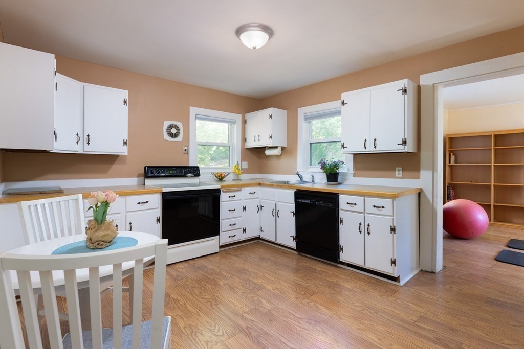 9 Belfry Terrace Lexington, MA 02421 - Photo 10 of 23 a kitchen with granite countertop a white cabinets and window