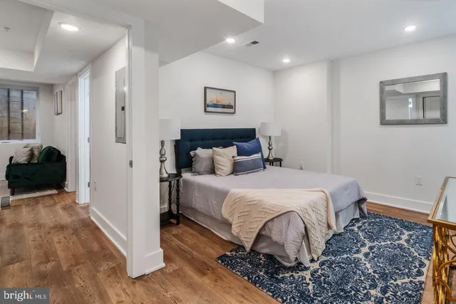 a bedroom with a bed and a view of bedroom