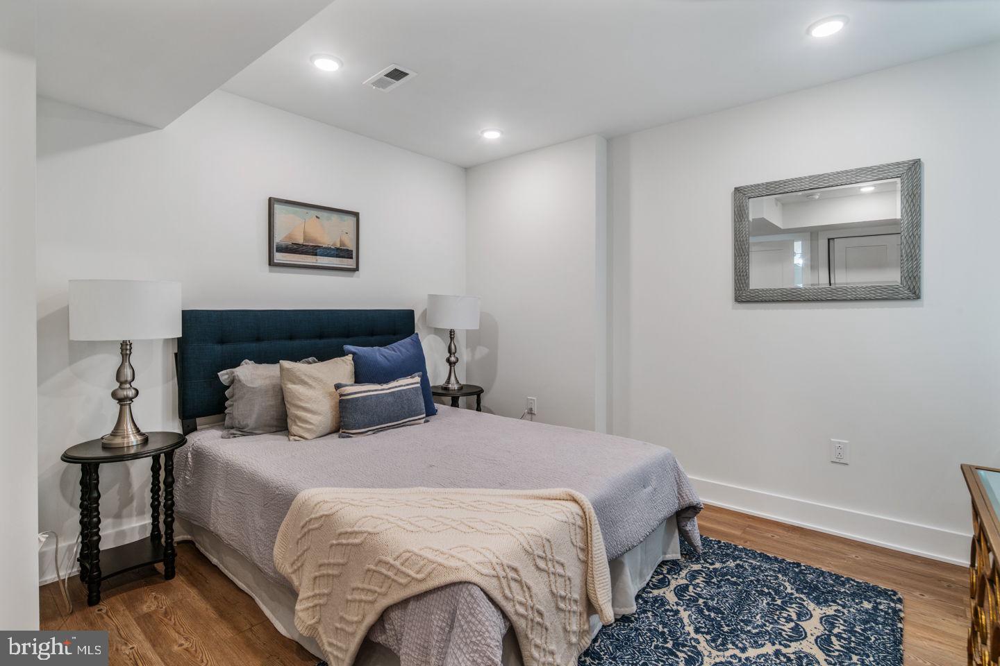 1910 Brown Street Philadelphia, PA 19130 - Photo 17 of 31 a bedroom with bed and wall painting