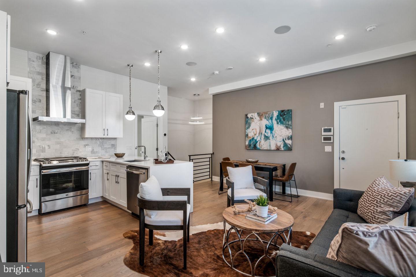 1910 Brown Street Philadelphia, PA 19130 - Photo 2 of 31 a large kitchen with a table and chairs
