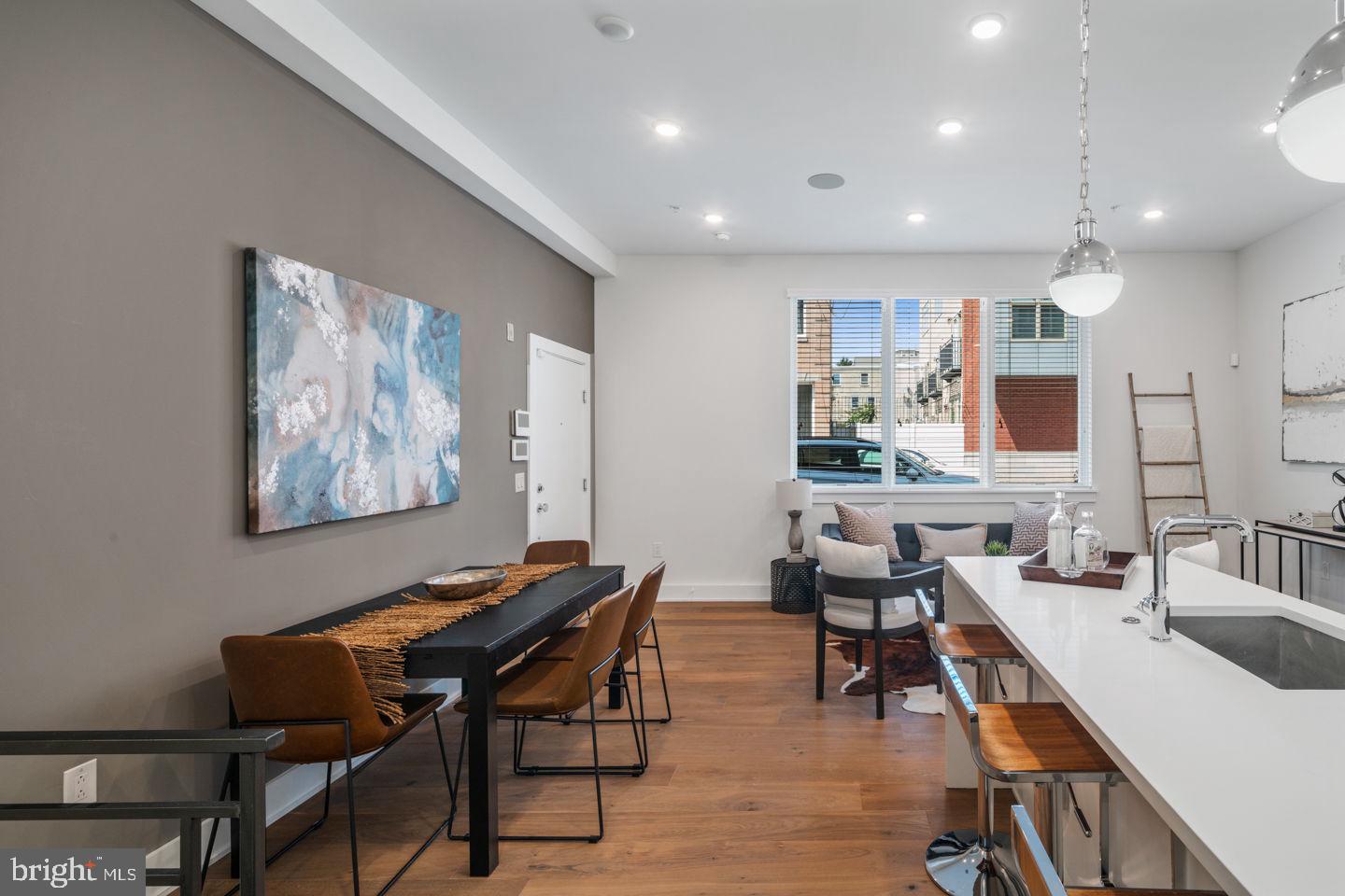 1910 Brown Street Philadelphia, PA 19130 - Photo 5 of 31 a view of a dining room with furniture window and wooden floor