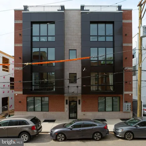 front view of a house with car parked